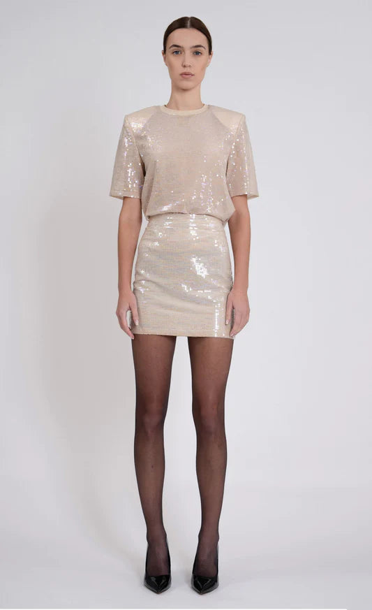 Valerie Skirt by Nonchalant | Make a statement in the Valerie Skirt, crafted from blush-tone sequins for an elegant effect. The mini skirt design is perfect for any special occasion, ensuring you make an impact at parties and other events. | Alene Too locate din Boca Raton, FL