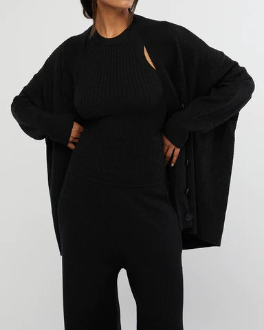 Oversized Cardigan by WeWoreWhat | oversized cardigan is made from cozy cable knit with drop shoulders and ribbed trimming. Relaxed fit Button-down | Alene Too located in  FL